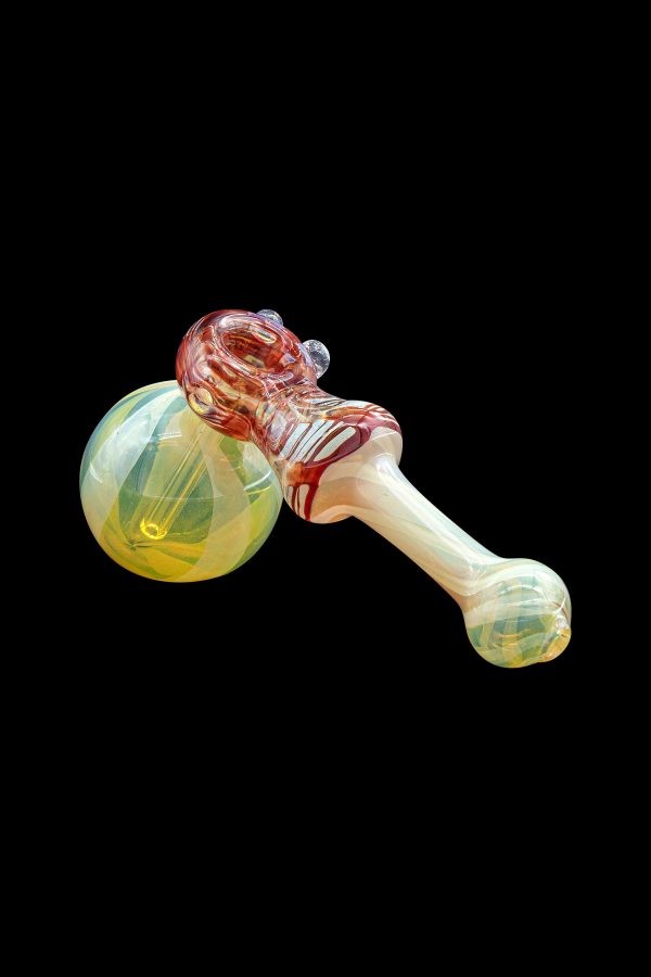 Hand-blown glass cannabis pipe with red and yellow swirls.