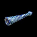 Blue and white patterned glass pipe isolated on a black background.