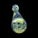 Green and purple glass cannabis pipe against a black background.