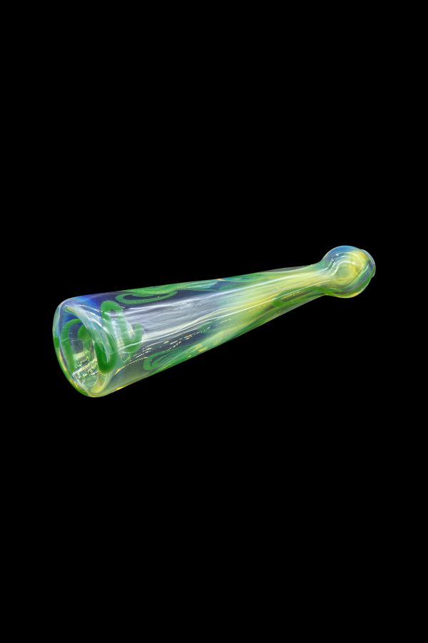 Green and iridescent glass oil burner pipe on a black background.