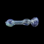 Glass pipe with blue and white swirling patterns against a black background.