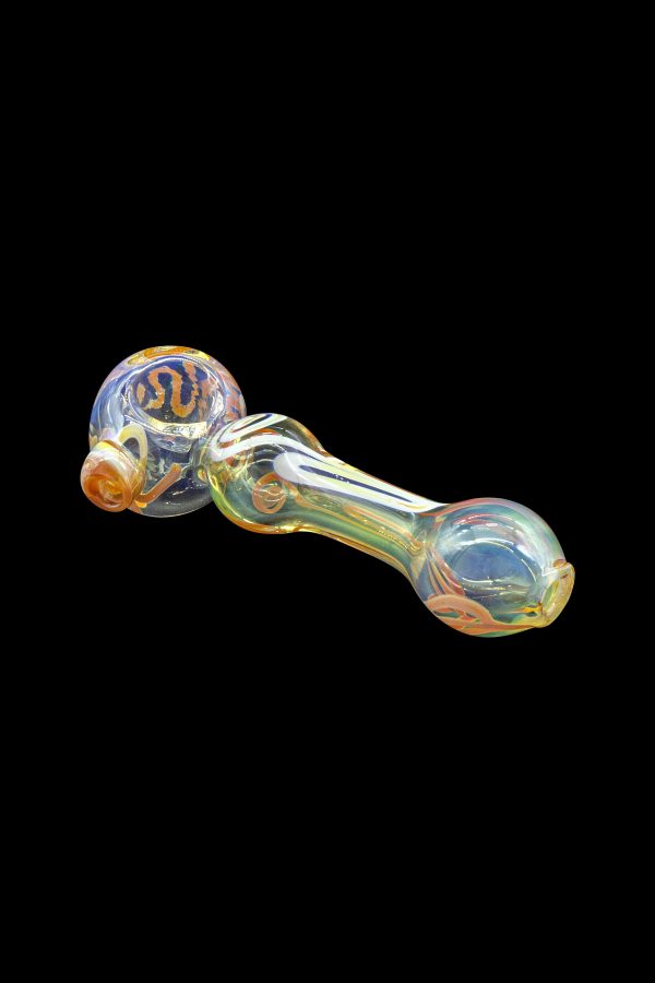 Iridescent glass pipe with orange and gold accents against a black background.