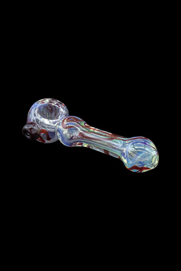 Hand pipe with red, white, and blue glass swirls on a black background.
