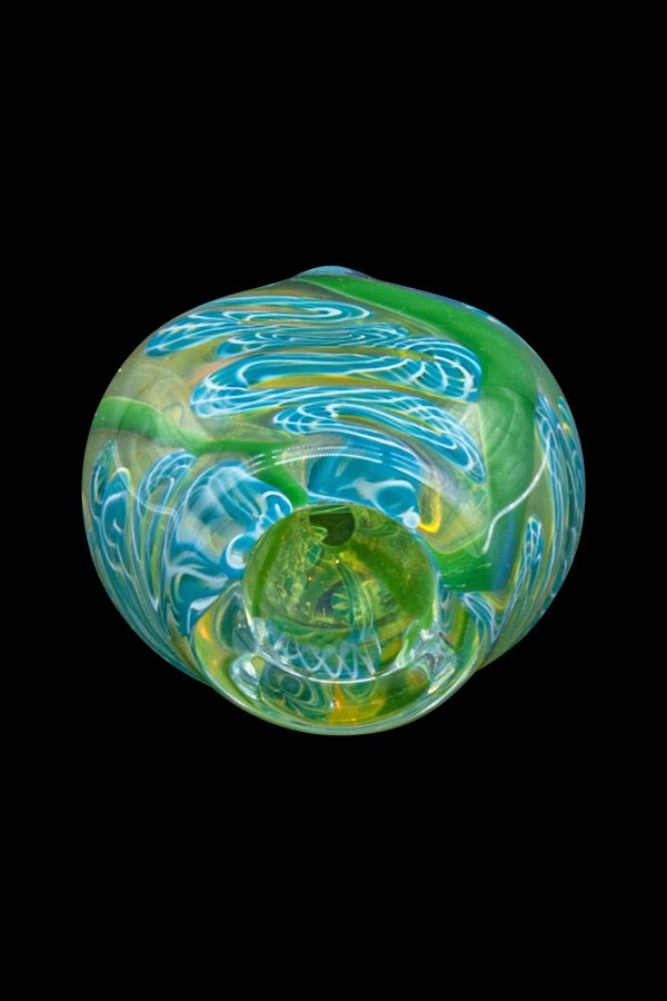 Green glass cannabis water pipe with swirling blue and yellow patterns.
