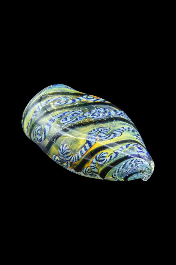Hand-blown glass cannabis pipe with intricate green, blue, and white patterns.