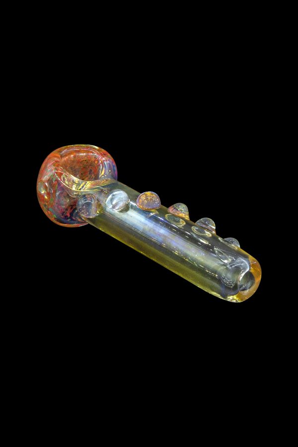 Iridescent glass smoking pipe against a black background.