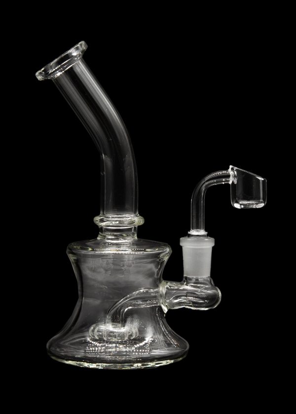 Clear glass dab rig with a quartz banger, isolated on a black background.