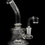 Clear glass water pipe (bubbler) with a quartz oil rig attachment, isolated on black.