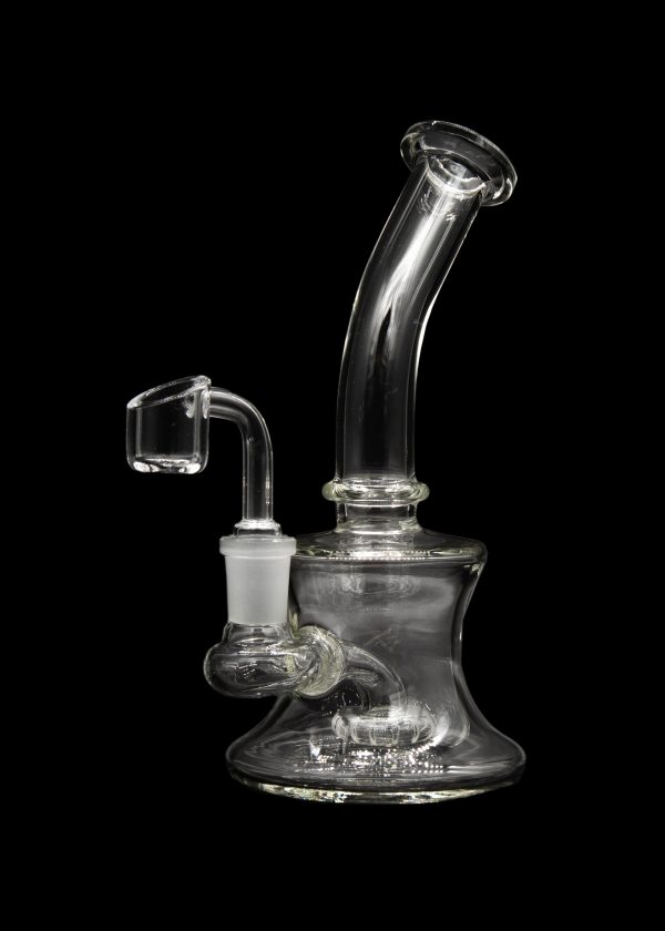 Clear glass dab rig with a quartz banger, isolated on a black background.