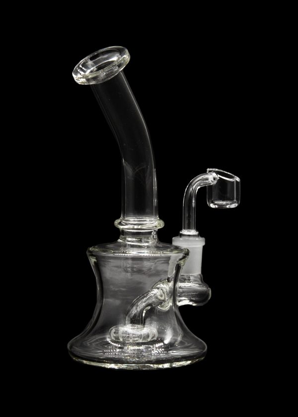 Clear glass dab rig with a quartz banger, isolated on a black background.