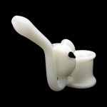 White glass bubbler pipe for smoking cannabis, studio shot on a black background.