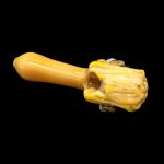 Hand-blown glass cannabis pipe with a textured, yellow and cream colored bowl.