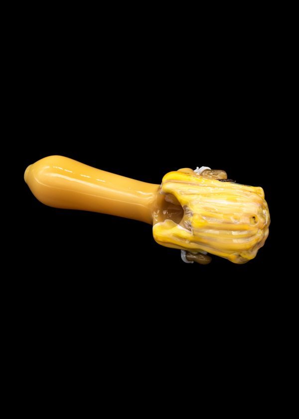 Hand-blown glass cannabis pipe with a textured, yellow and cream colored bowl.