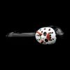 Glass cannabis pipe shaped like a clown head with red accents, against a black background.