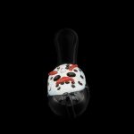 A mushroom-shaped glass pipe with a white speckled cap and red accents, against a black background.