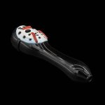 Black glass pipe shaped like a ladybug with red and white detailing, isolated on a black background.