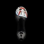 Glass cannabis pipe with colorful speckled mushroom-shaped bowl, isolated on black.