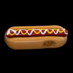 Glass pipe shaped like a hot dog with mustard and ketchup.