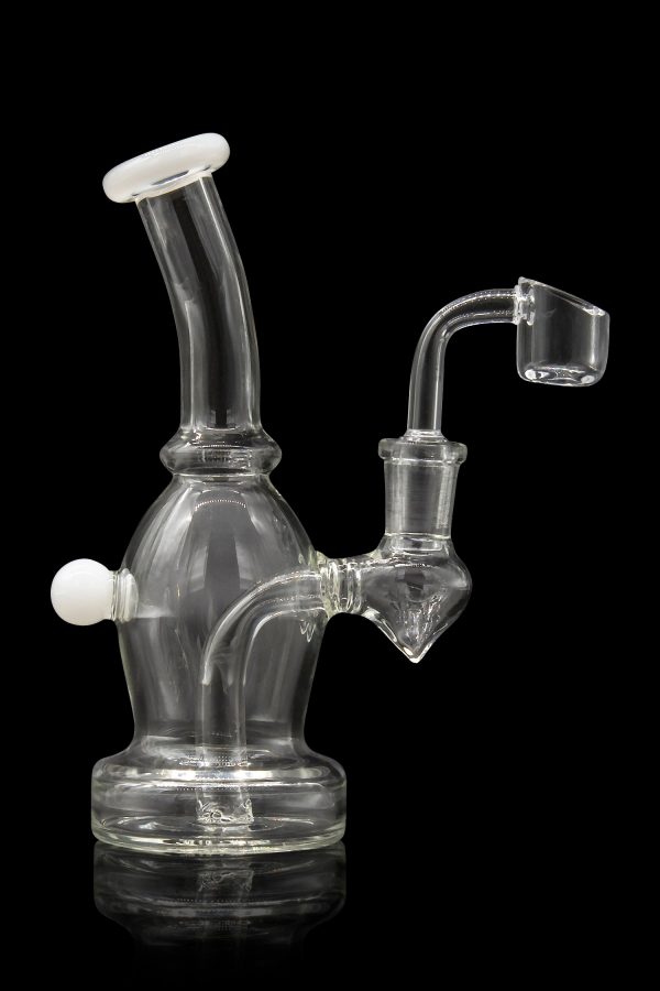 Clear glass dab rig with a quartz banger, studio shot on a black reflective surface.