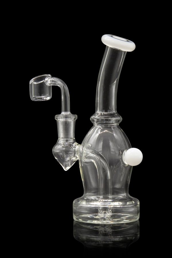 Clear glass dab rig with a quartz nail, isolated on black.