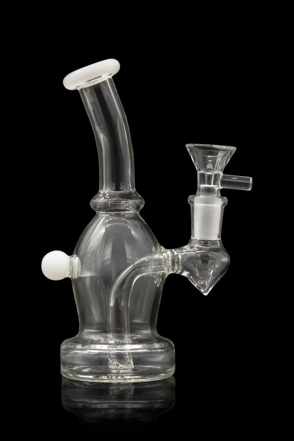 Clear glass bubbler water pipe with white accents, studio shot on a black reflective surface.