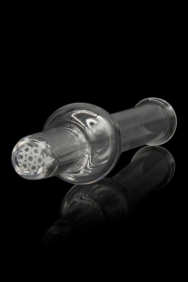 Glass cannabis pipe with intricate honeycomb filtration, reflected on a dark surface.
