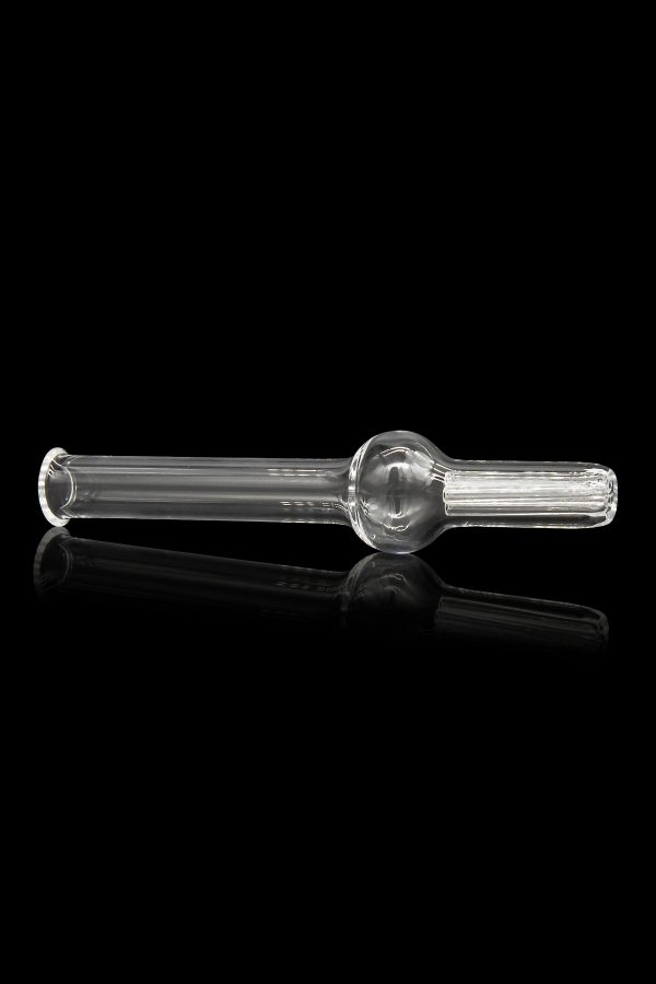 Clear glass oil burner pipe with a spherical bowl and textured mouthpiece, reflected on a black surface.