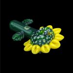 Green and yellow glass cannabis pipe shaped like a flower.