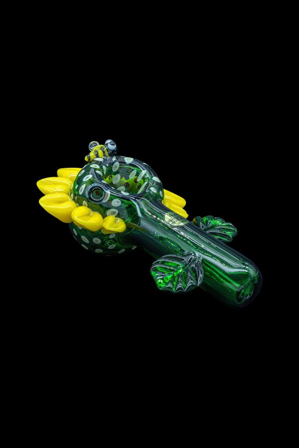 Hand-blown glass pipe shaped like a crocodile with vibrant green and yellow accents.