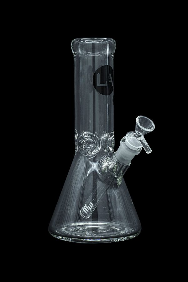 Clear glass bong with intricate design and ice catcher, isolated on a black background.