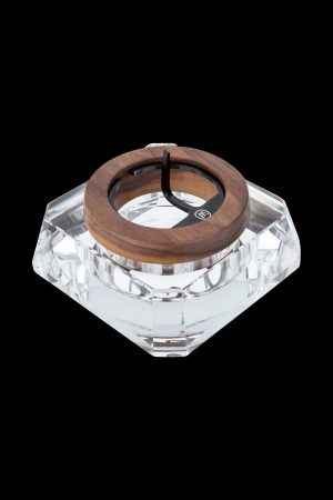 A top-down view of the Marley Natural Crystal Ash Tray, showcasing its clear, faceted design against a dark background.
