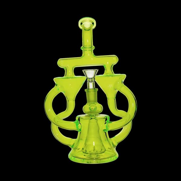 Green glass dab rig with intricate looping design.