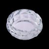 Clear glass ashtray with faceted design.