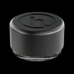 Black silicone cannabis concentrate container with clear base.