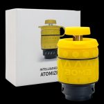 Yellow grenade-shaped cannabis vaporizer with packaging.