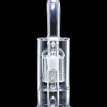 Clear glass dab rig with intricate percolators, illuminated with blue light against a black background.