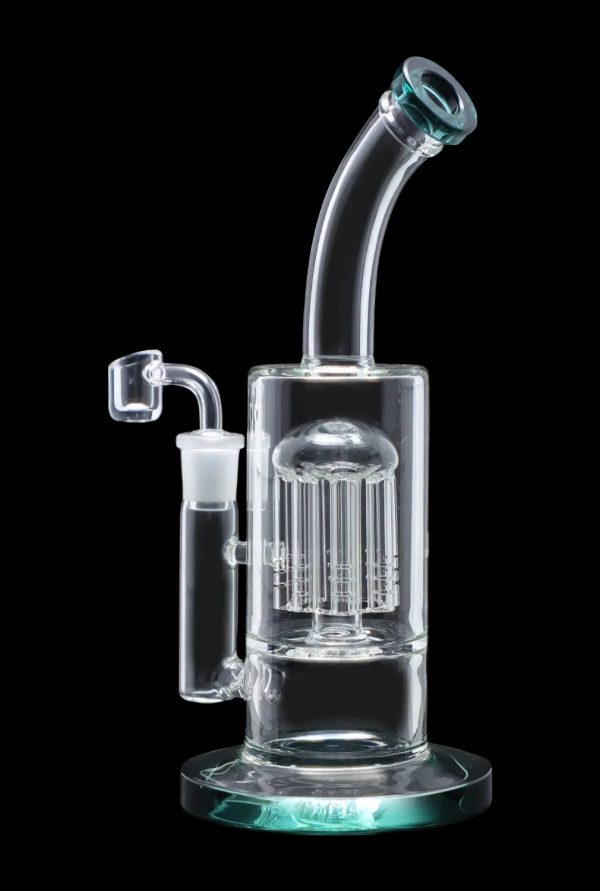Clear glass water pipe (rig) with a perc diffuser, isolated on a black background.