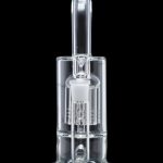 Clear glass dab rig with intricate percolator design, isolated on black.