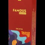 A red box for “Famous Brandz” one-hitter, featuring colorful abstract designs and details about its durable aluminum frame and stash compartment.