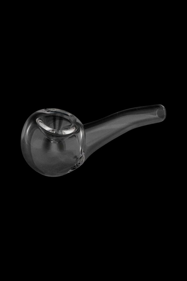 Clear glass pipe against a black background.