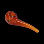 Amber glass smoking pipe on a black background.