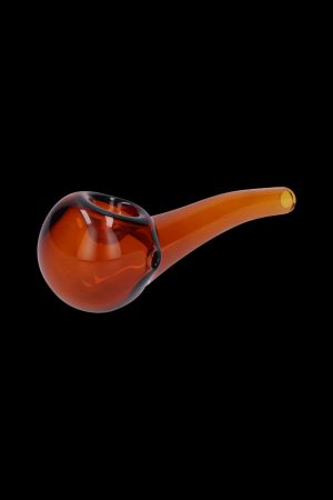 Amber glass pipe isolated on a black background.
