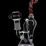 Glass water pipe (bong) with colorful accents, isolated on a black background.