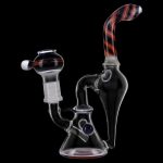 Clear glass water pipe (rig) with red and white striped accents, studio shot on black background.