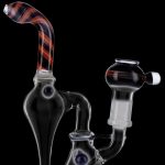 Clear glass water pipe (rig) with red and white striped mouthpiece and percolator, isolated on a black background.