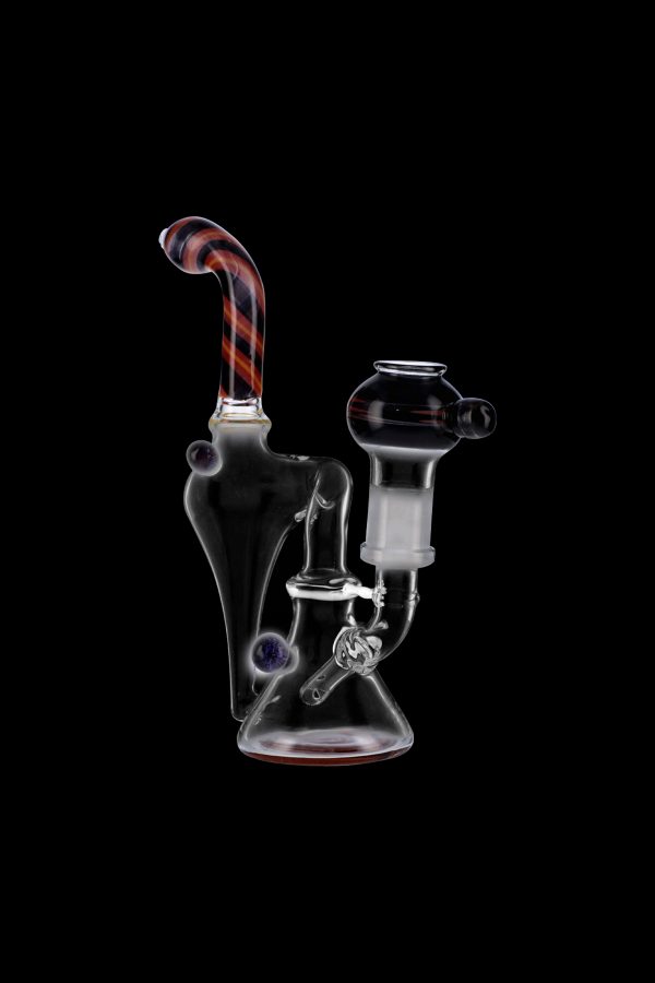 Clear glass water pipe (rig) with colorful accents, isolated on a black background.