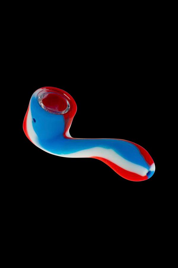A colorful glass pipe against a black background.