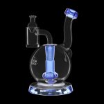 Blue glass dab rig with a quartz banger, isolated on a black background.
