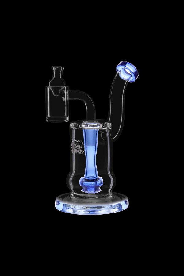 Blue glass dab rig with accessories against a black background.