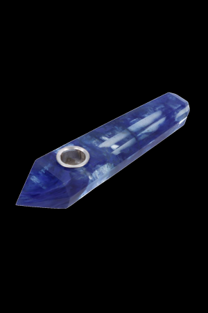 Blue glass pipe with metal bowl, isolated on black.